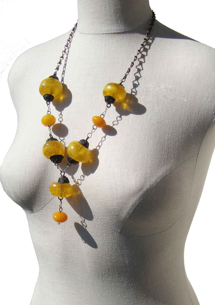 Lot 16 - Old amber bead necklace with a string of